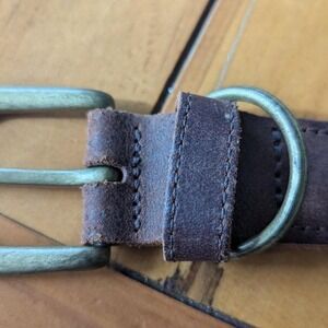 Vintage brown leather belt‎ with worn goldish belts buckle